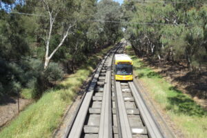 O-Bahn bus passing under a shared bridge at Windsor Gardens [2024]