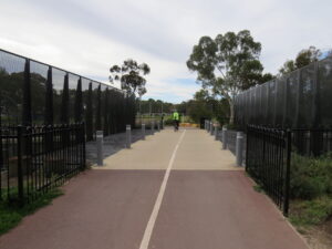 Crossing shared bridge over the Outer Harbor Railway Line [2021]