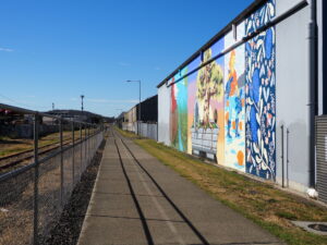 There are several walls of professional art along the path 2022