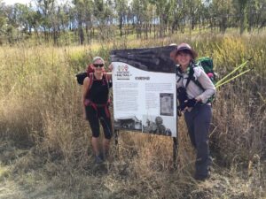 Interpretive signage is photo opp at former sidings [Karen Davidson 2020]