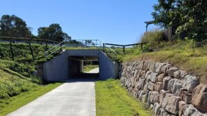 An underpass has been constructed to take the rail trail under a new road between Nikenbah and Urraween [2025]