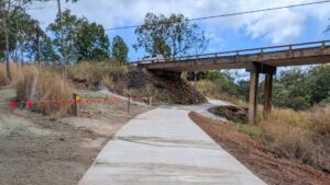 The rail trail diverges off the corridor at Rocky Creek to go under the busy Kennedy Highway [Atherton Shire Council 2025]