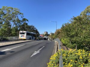 O-Bahn bus entering tunnel in Adelaide Parklands. Trail starts to the right [2025]