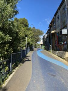 Blue strip leads visitors along Blacksmiths Way, Belgrave [2023]
