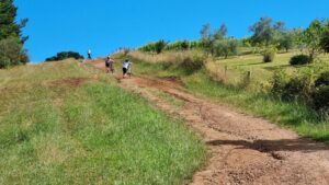 There is a steep descent to get onto the railway alignment. The surface has been improved since this photo [2021]