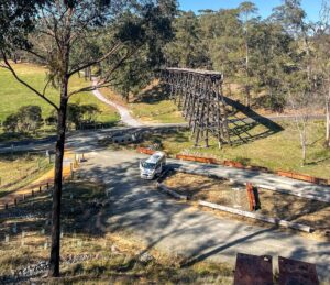 Charred remains of O'Grady Creek Bridge after 2011 bushfire were retained at insistence of community [2023]