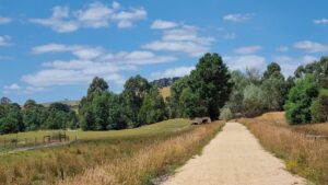 The rail trail approaching Loch has a crushed sandstone surface [2022]