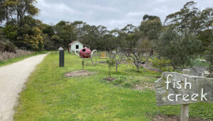 The station site at Fish Creek features a pretty community garden [2025]