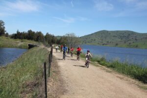 The reservoir is almost full as these riders approach Tallangatta [2012]