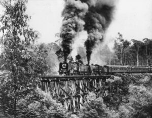 Two K-Class locos cross Boggy Creek Bridge with a 1960s excursion train