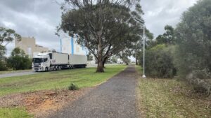 The dairy factory overlooks this part of the trail in Cobden [2024]