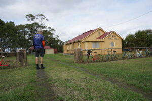 Old bikes decorate the fence at Glenfyne Public Hall [2024]